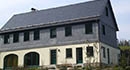 Wohnhaus mit Bogenschnittschablonendeckung 30 x 30